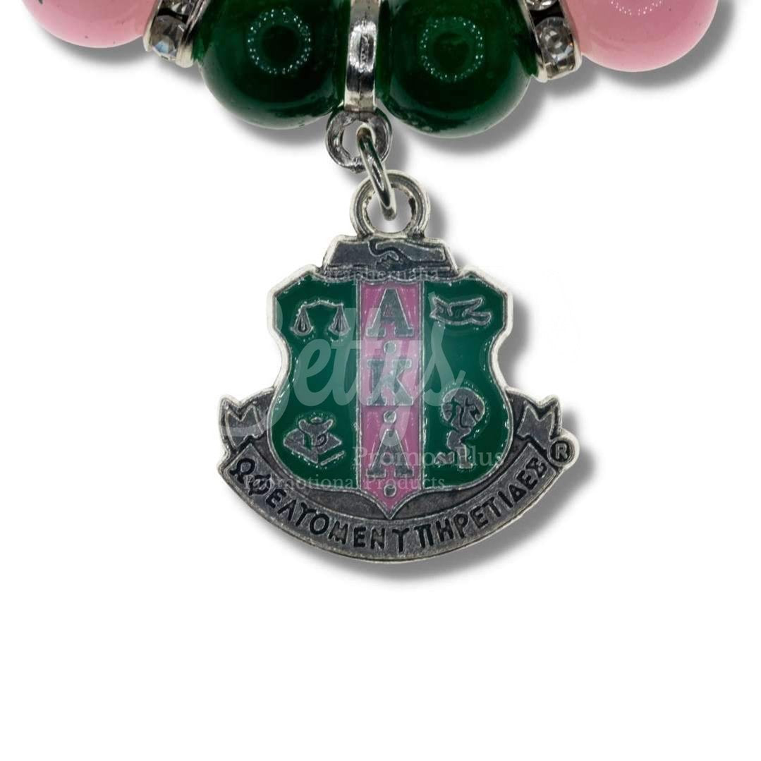 Alpha Kappa Alpha AKA Pink and Green Beaded Bracelet with AKA Shield Charm, AKA BraceletPink-Betty's Promos Plus Greek Paraphernalia